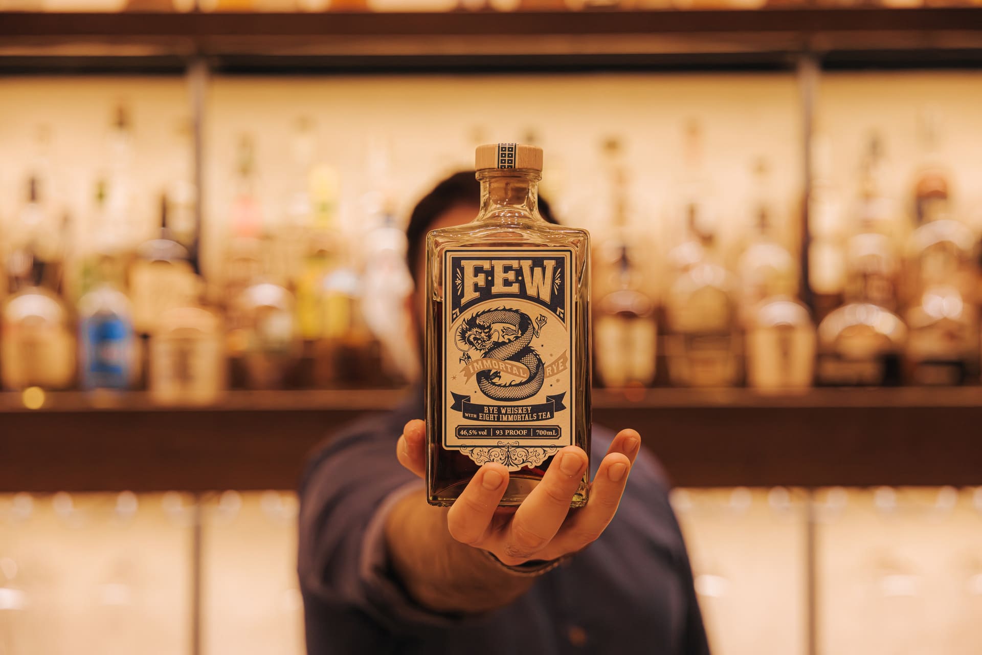 Bottles from the American whiskey collection lined along the back bar
