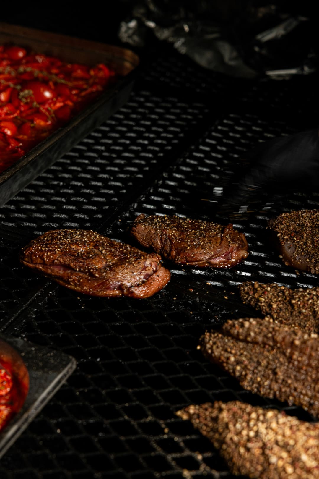 Meats and breads warming together in the smoker